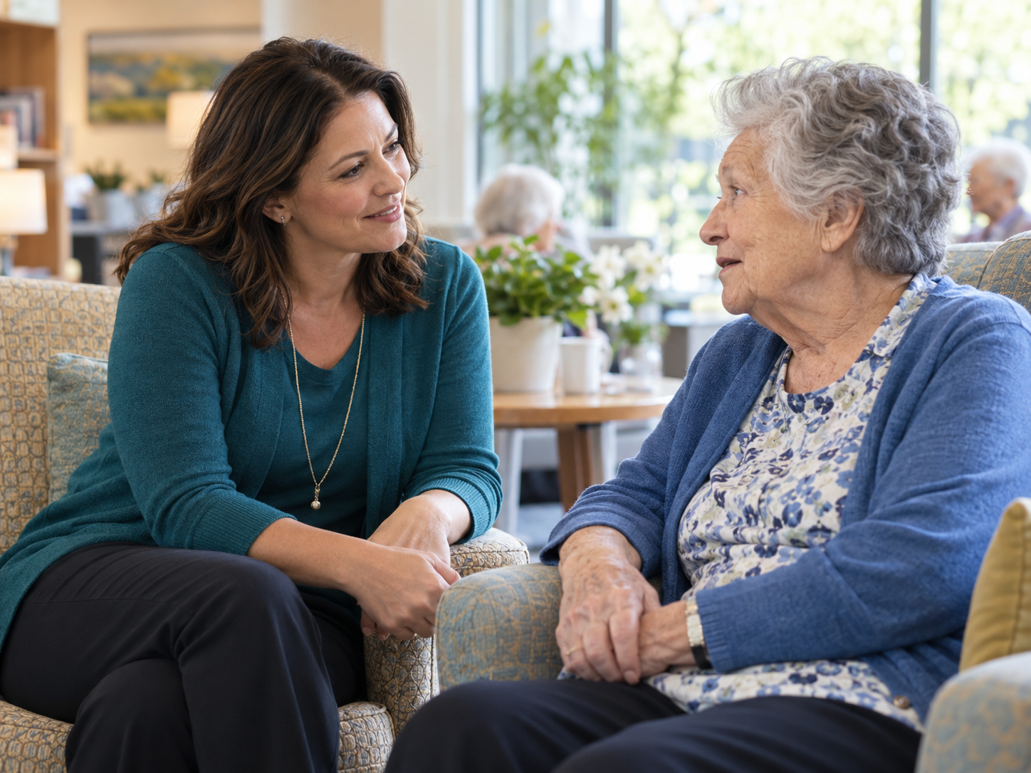 Social service professional speaking with an older adult in a care setting